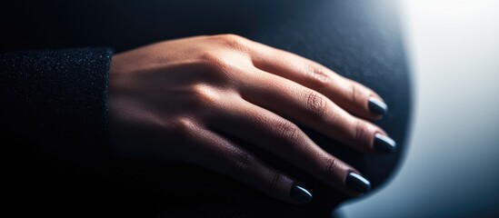 Professional female hands in a business suit highlighting elegance and professionalism against a soft-focus white background