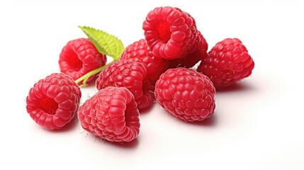 Fresh ripe raspberries arranged with a green leaf on a clean white background showcasing vibrant colors and natural textures