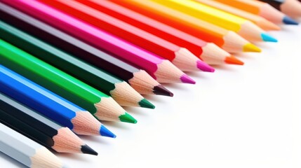 Fototapeta premium Colored pencils arranged on a white background ideal for artistic education and creative drawing activities