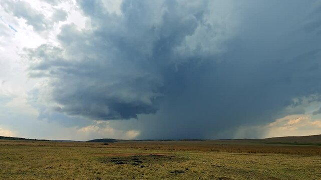 Time lapse of stormy weather cell moving over open wilderness landscape