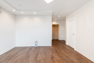 Fototapeta premium Empty Home Kitchen Interior. White Walls Room. Interior Empty Room with White Walls and Wooden Floor.