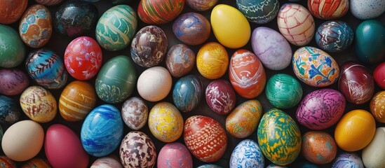 Fototapeta premium Assorted colorful Easter eggs beautifully painted for festive decoration and family activities during the holiday season.