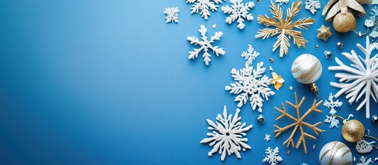 Fototapeta premium Happy New Year festive design with snowflakes and ornaments on a vibrant blue background ideal for holiday celebrations and greetings
