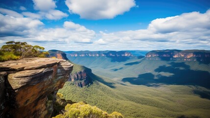 Fototapeta premium Stunning panoramic view of Blue Mountains National Park showcasing dramatic rock formations and expansive mountainous landscape under a vibrant sky