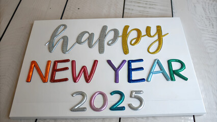 Colorful Happy New Year 2025 with Silver Brush Lettering on White Background