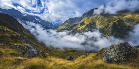 Observing clouds suspended in the valley during a mountain journey, where the beauty of clouds enhances the tranquil scenery of the mountains for an unforgettable experience.