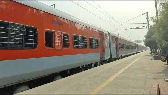 Delhi, India, November 02 2024 - Indian railway express train at departure from Anand Vihar railway station during morning time, Colourful Express train at Delhi railway station