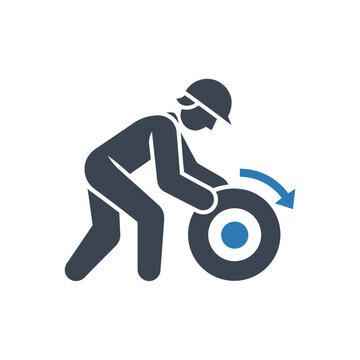Worker rolling a wheel forward icon