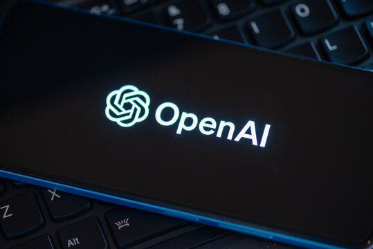Hand pointing at SearchGPT page seen on the smartphone and official OpenAI company logo on background. New AI search tool. GPT-6 Astra