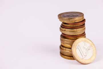 Aerial Image of One Euro Coins Arranged in a Column on White