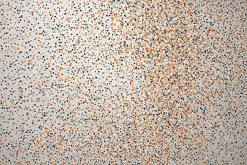 Fototapeta premium a close up of a wall with a bunch of dots on it