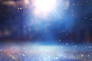 Fototapeta premium abstract glitter black and blue lights background. de-focused
