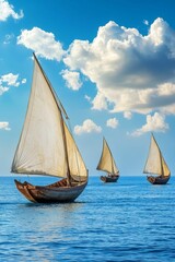 Fototapeta premium Three dhows sail under a bright blue sky.