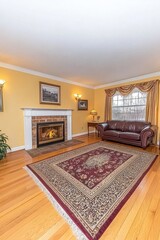 Fototapeta premium Cozy Fireplace in Elegant Living Room with Oriental Rug