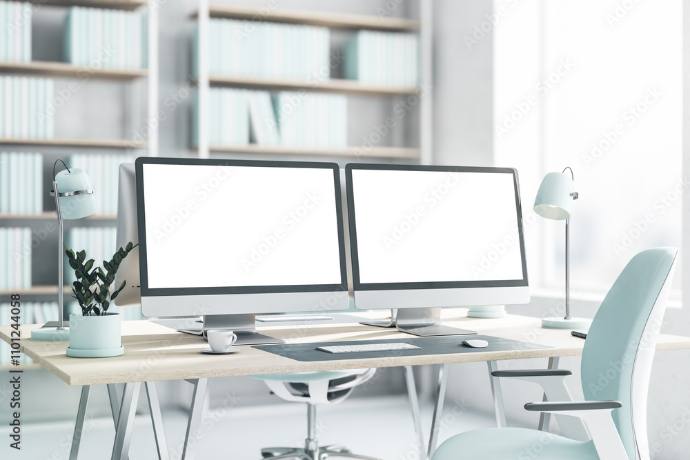 Poster side view on blank white modern computer monitors on light wooden table with light blue lamp, flower