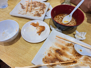 Kitchen waste on white plate and bowl, food scraps, left over, discarded food.