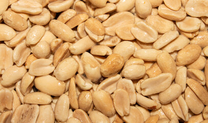 Roasted salted peanuts.Peanuts in butter.Nuts are peanuts background.The texture of roasted peanuts.