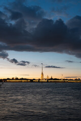 Naklejka premium Saint Petersburg. View of the Peter and Paul Fortress after sunset in summer, the surface of the Neva River