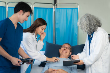 Fototapeta premium Female Doctor and Assistant Examining Male Patient's Health.