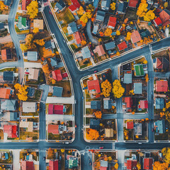 aerial view of colorful suburb with fall foliage and winding roads