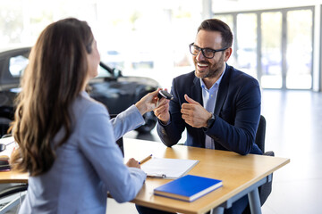 Customer buyer client wear shirt sign paper contract document with salesman choose auto want buy...