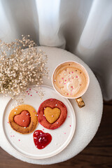 Homemade pancakes with strawberry sauce, cappuccino, woman day morning concept, Valentine's day, February