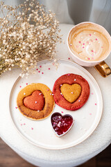 Homemade pancakes with strawberry sauce, cappuccino, woman day morning concept, Valentine's day, February