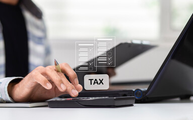 Businessman using calculator and calculate tax  at workplace