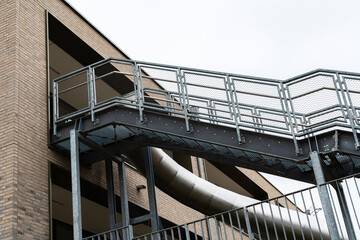 Metal slide and ramp structure at urban building entrance