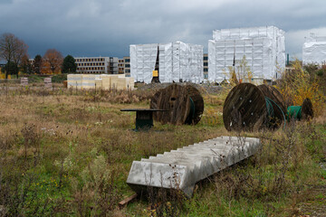 A building under construction covered with white polyethylene film