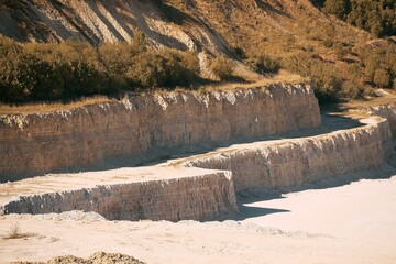 Sandy quarry under bright midday sun