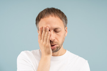 Man with exhaustion looks fatigued, unmotivated. Chronic fatigue by depression, sleep apnea, viral...