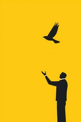 Fototapeta premium Man Releasing Bird Against Bright Yellow Background