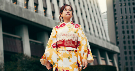 Fashion, kimono and thinking with Japanese woman in city for heritage, festival ceremony and culture. Traditional clothes, reflection and low angle with person and Japan outdoor for pride and peace