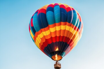 Fototapeta premium Colorful hot air balloons flying high in a clear blue sky