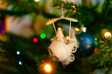 Christmas fir tree and Christmas decoration on blurred background. Close up. Selective focus.
