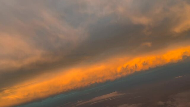 Fire sunrise recorded from the sky at sunrise. Aerial footage taken from a jet cockpit as seen by the pilots. 4K