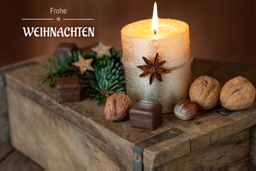 Christmas card with candle and German text Merry Christmas