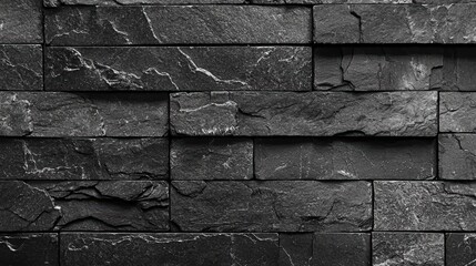 Textured black slate stone wall