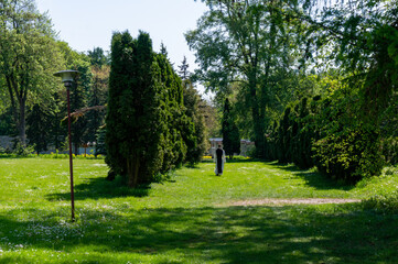 Green area near Cistercian monastery, monk, walk, solitude. Jedrzejow, Poland.