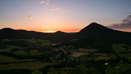 The landscape of the Bohemian Central Highlands and its highest mountain, Milešovka.