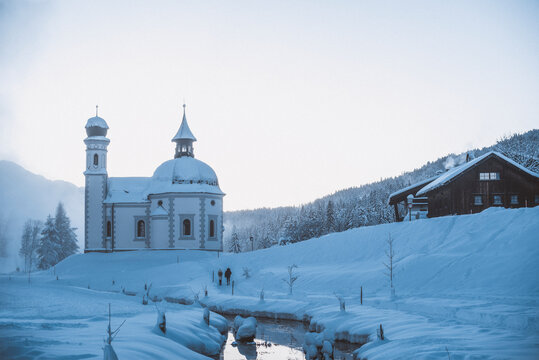 Seekirchl (Heiligkreuzkirchein) in rural winter landscape, Seefeld, Tyrol, Austria