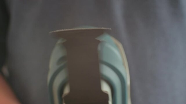 Detailed view of a highprecision cutting multi tool blade, highlighting its sharpness and intricate design