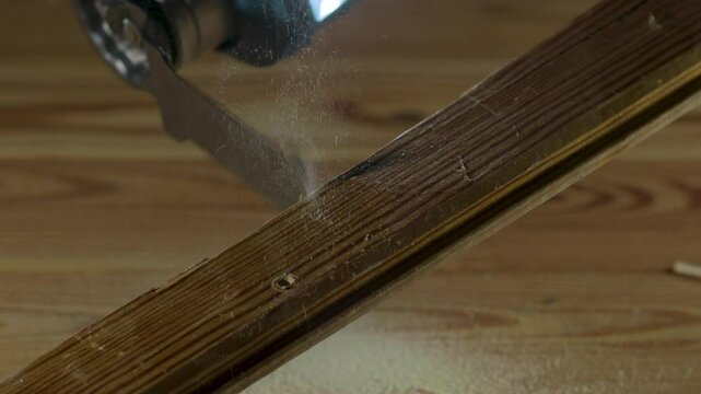 A detailed closeup view depicting a multi cutter saw blade meticulously cutting through a wooden plank with precision