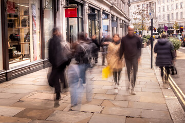 Busy shopping street scene with motion blur