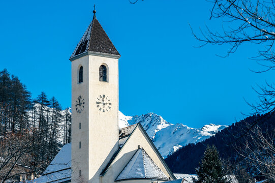 Bell tower of the ancient disappeared village of Curon. Lake Resia in winter.