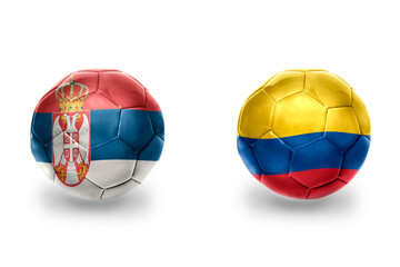 Obraz premium football balls with national flags of serbia and colombia ,soccer teams. on the white background.