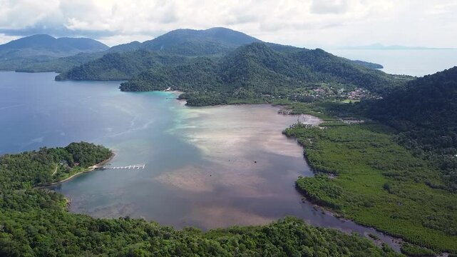 Aerial view of tropical island of Pulau Weh Sabang in Aceh, Sumatra, Indonesia with ocean, mangroves, forest and volcanic landscape