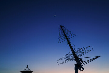 Astronomical telescope equipment, silhouette at sunset