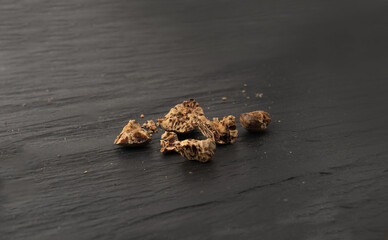 Nutmeg in Black Plate, Myristica Fragrans Fruit, Dry Spicy Nutmeg, Grated Whole Muscat Nut, Nut Meg